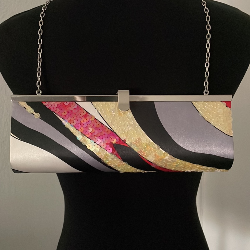 Lapis over the shoulder/clutch.
